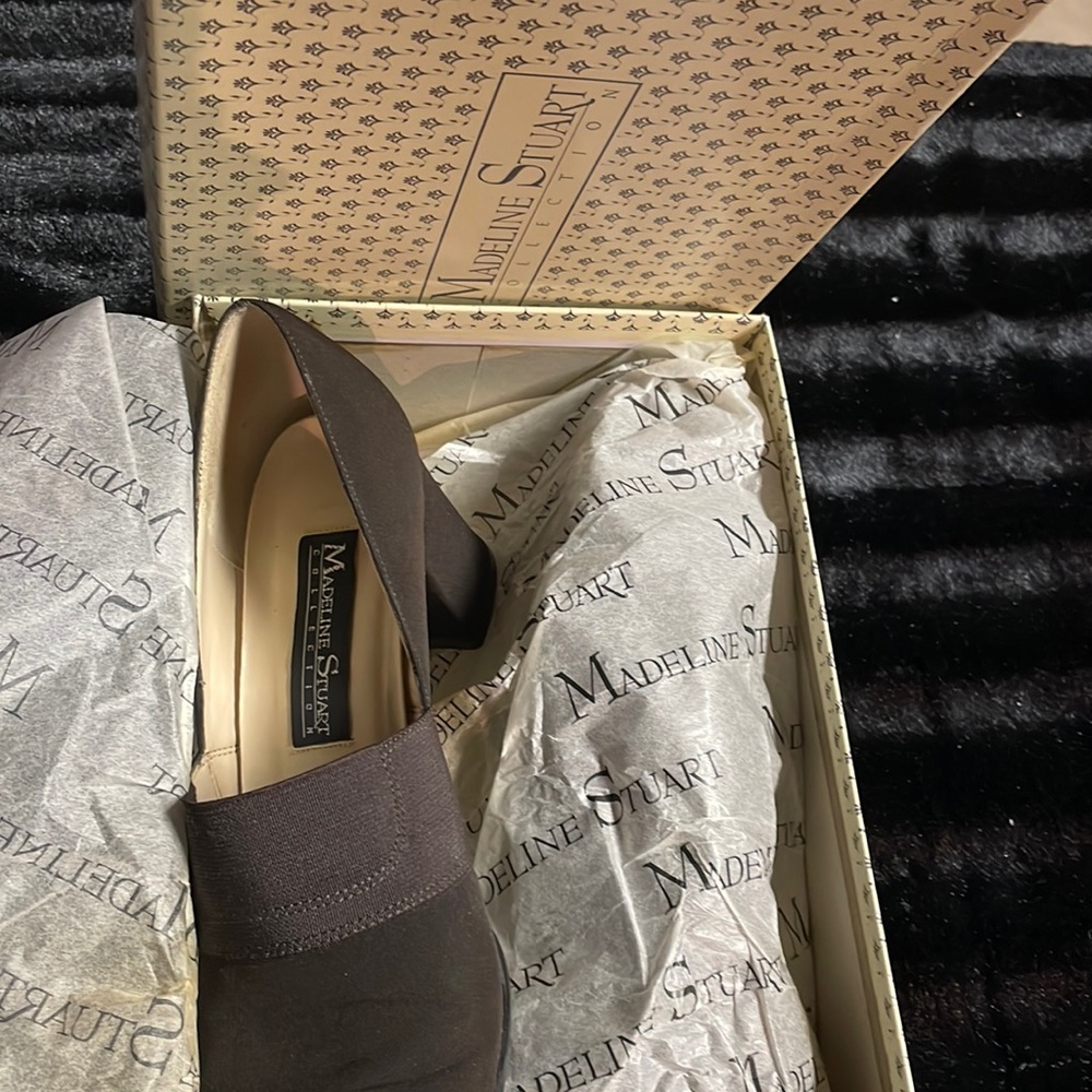 Brown canvas slip on high heel with 2-1/2” heel.